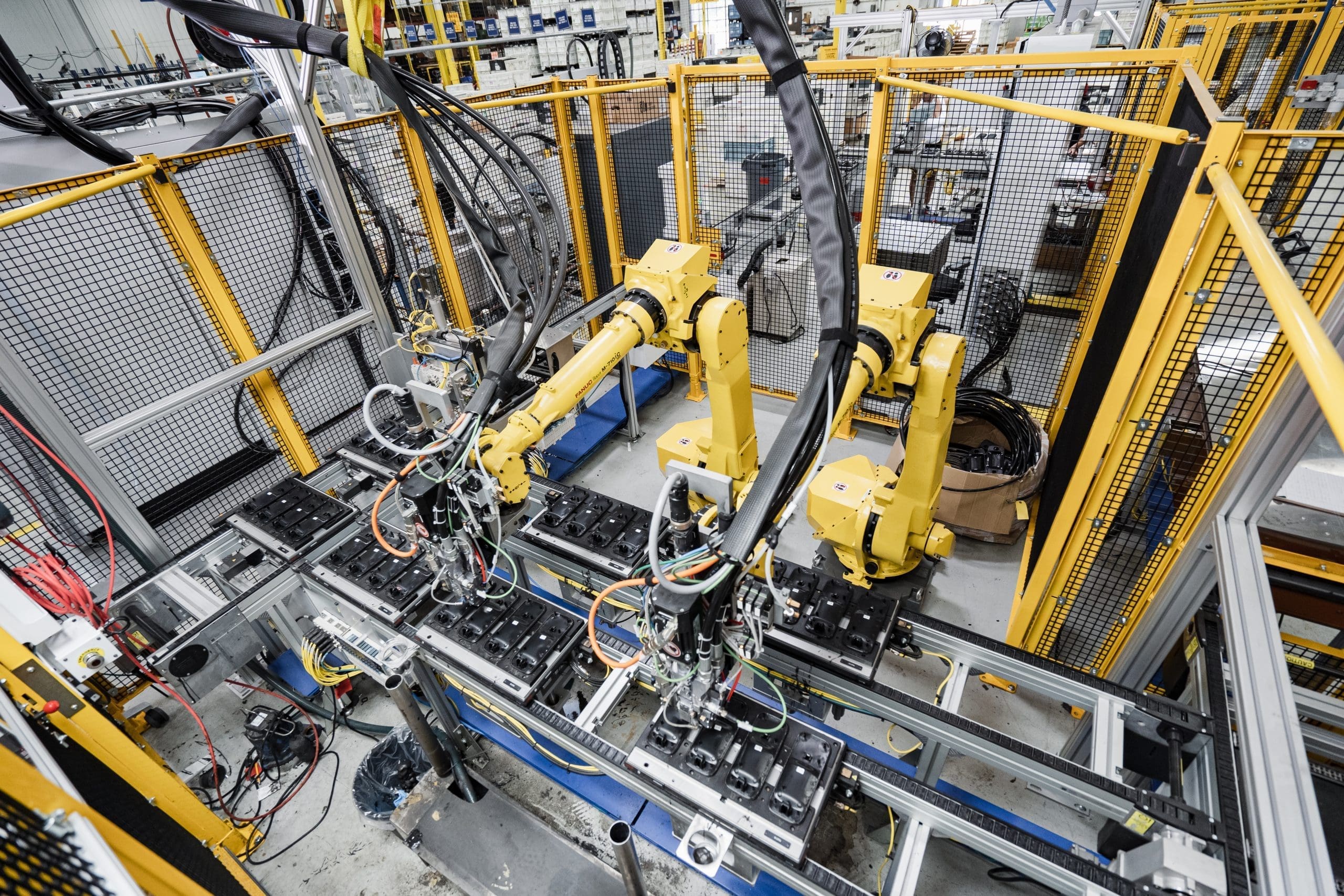 OEM automotive supplier manufacturing facility with robotic arms ensuring precision and efficiency